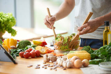 People preparing fresh vegetables together